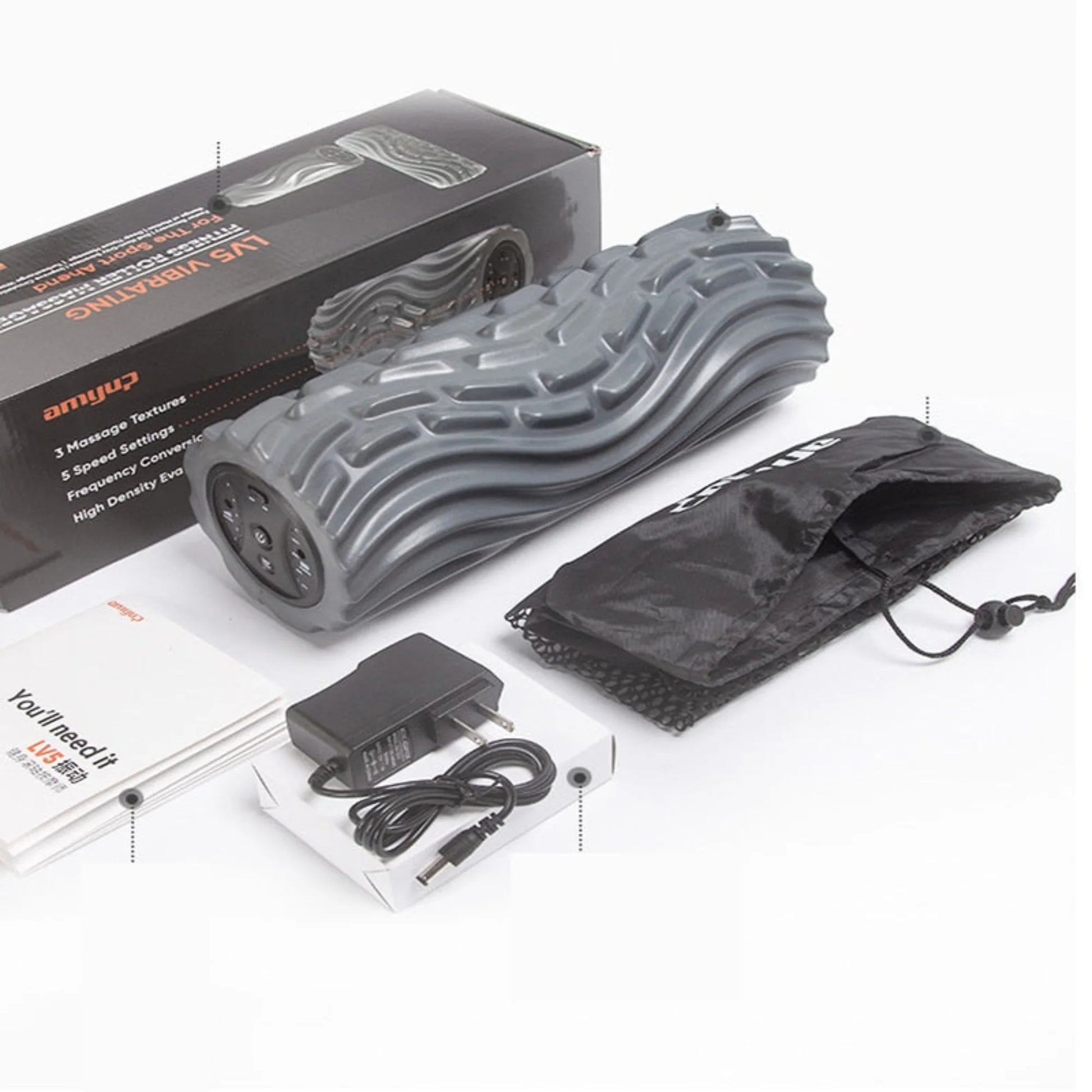 Pro vibration foam roller with full package contents including charging cable, instruction manual, and storage packaging displayed on white background
